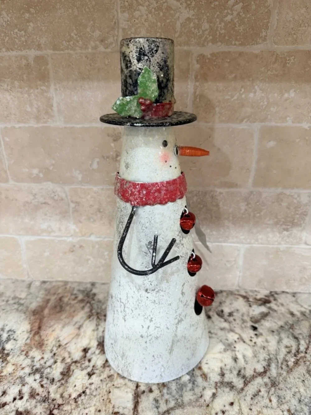 Folk-art metal cone snowman top hat, scarf, wire arms, red jingle bell buttons.